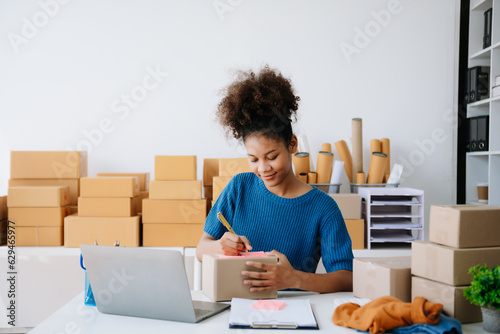 Small business entrepreneur SME freelance woman working at home office, BOX,tablet and laptop online, marketing, packaging, delivery, e-commerce concept.