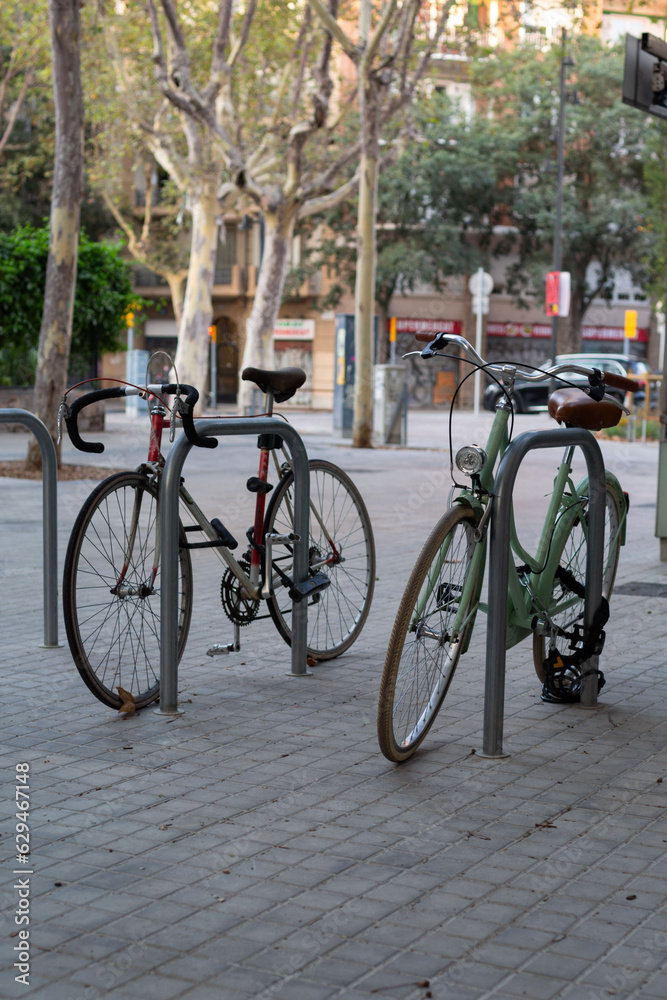 Bicycles parked on a city street. Healthy lifestyle. Caring for the environment.