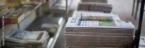 Newspapers are sold on the street. Information, news on paper.