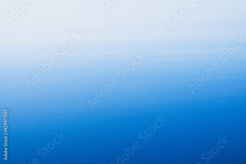 Blue sea water surface texture for background with colour gradient. Abstract nature image.