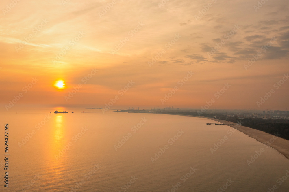 Beach of the Baltic Sea in Gdansk at sunrise. Poland