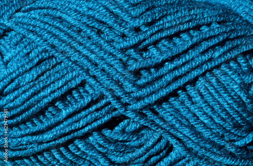Skein of yarn close up. Turquoise wool blend yarn.