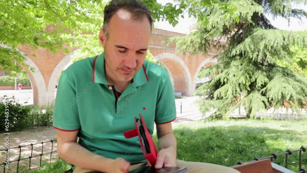 man taking a phone call in the park