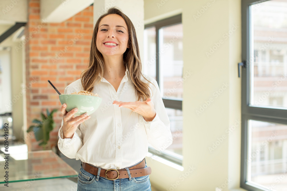 pretty woman smiling cheerfully, feeling happy and showing a concept. breakfast bowl concept pretty woman smiling cheerfully, feeling happy and showing a concept. breakfast bowl concept