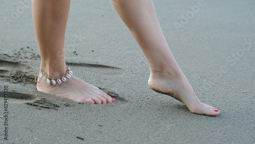 woman walking by the sea
