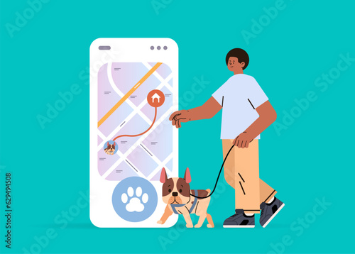 guy owner with cute dog using walking app on smartphone best friends domestic animal friendship concept