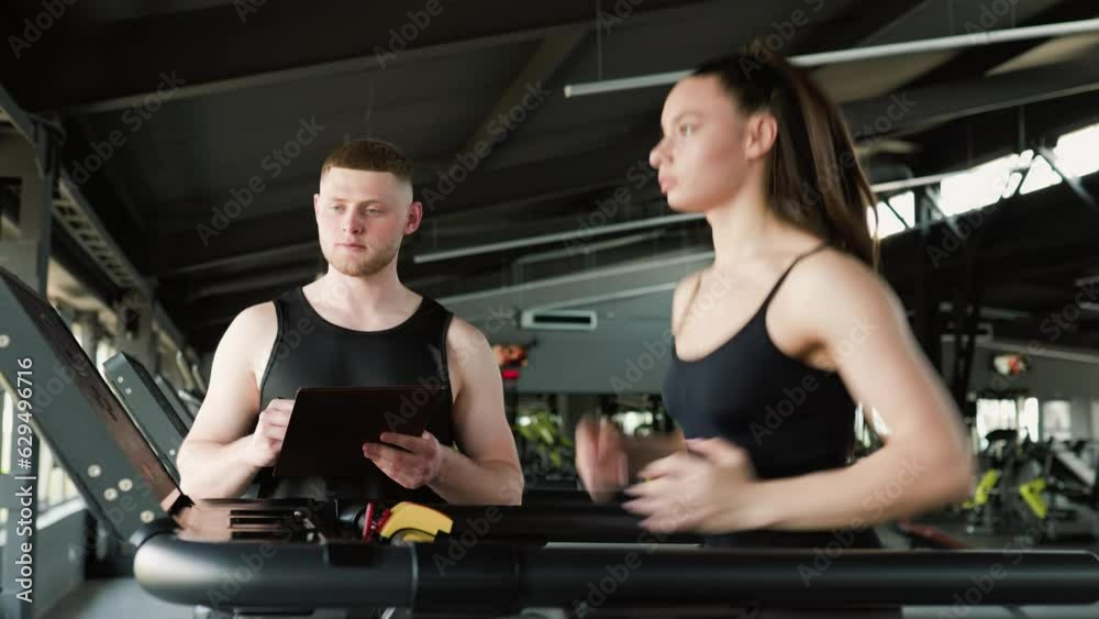 Two women, one Caucasian and one Hispanic, engaged in a dynamic running session with their male trainer at an outdoor fitness facility. Active Young Woman Receiving Professional Training from Two women, one Caucasian and one Hispanic, engaged in a dynamic running session with their male trainer at an outdoor fitness facility. Active Young Woman Receiving Professional Training from
