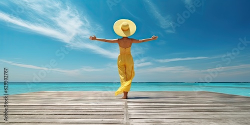 Travel concept. Beautiful woman standing on beach and sea with copy space © Thares2020