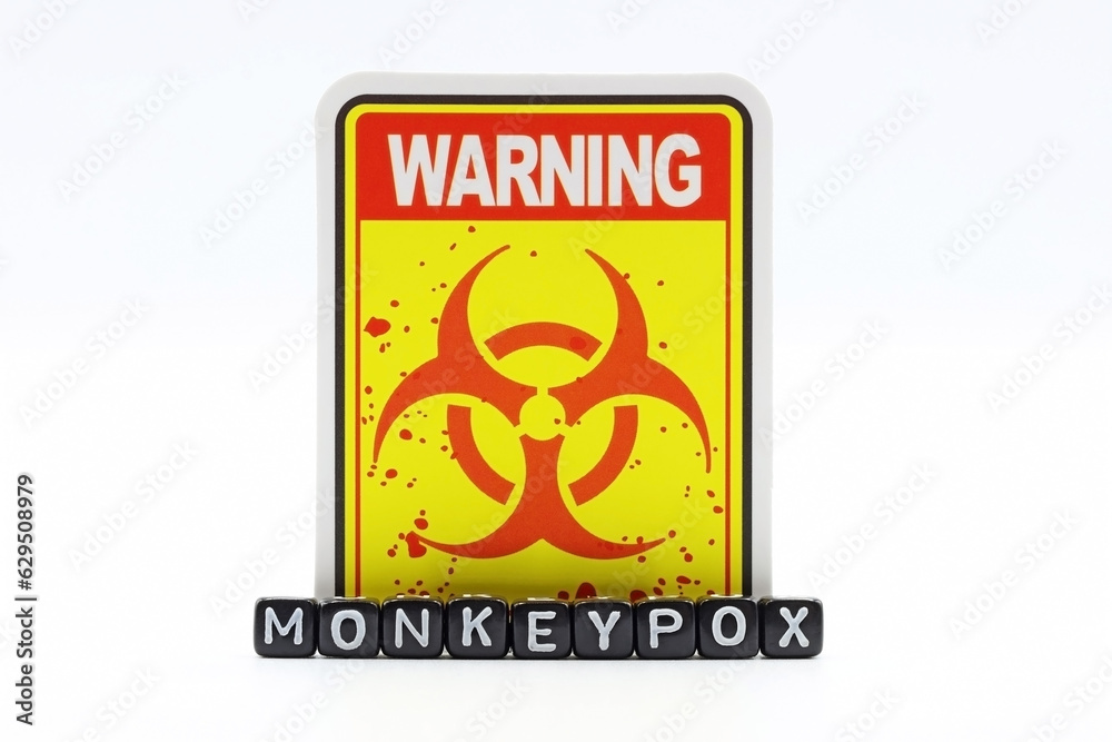 The word monkey pox under the Biohazard signal