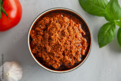 Homemade Sun Dried Tomato Pesto in a Bowl, top view. Flat lay, overhead, from above.