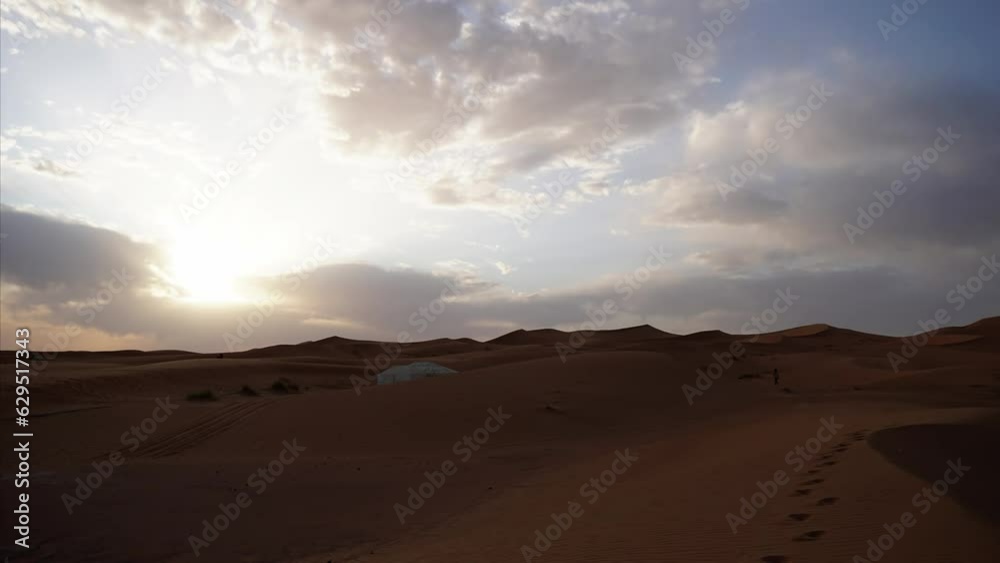 Timelapse video from Morocco, Sahara Desert, Merzouga, tourists crossing through the sand dunes.