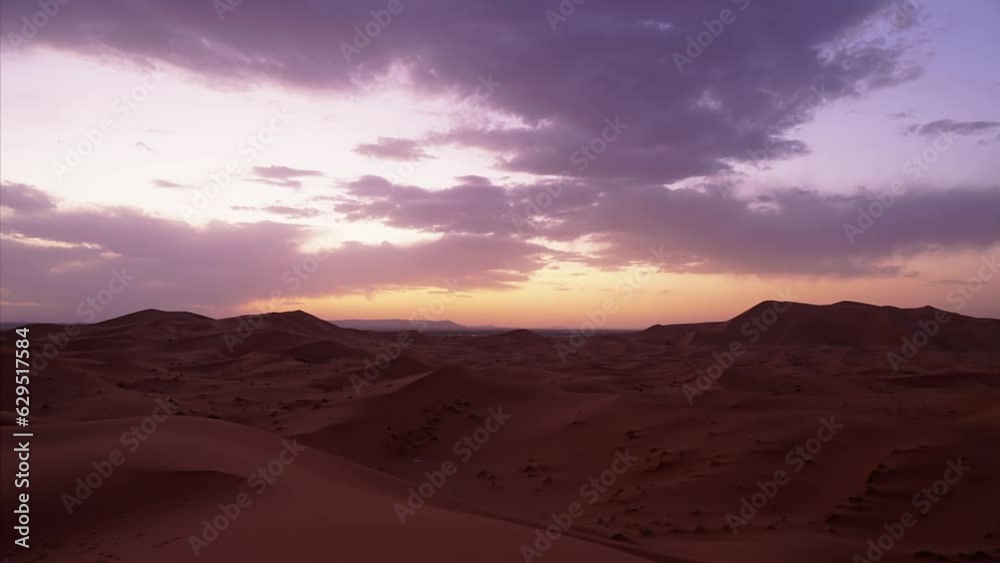 Amazing timelapse video from Morocco, Sahara Desert, Merzouga. Caravans returning during sunset meanwhile the village lights show up in the background.