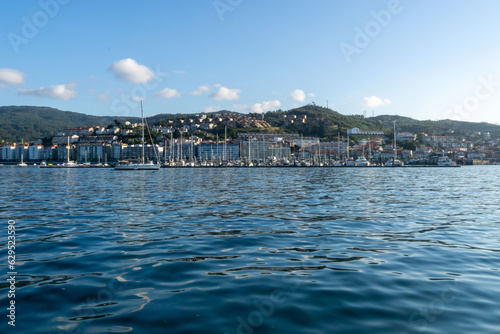 The town of Baiona from the sea. In the foreground is the marina. Rias Baixas, Galicia, Spain.