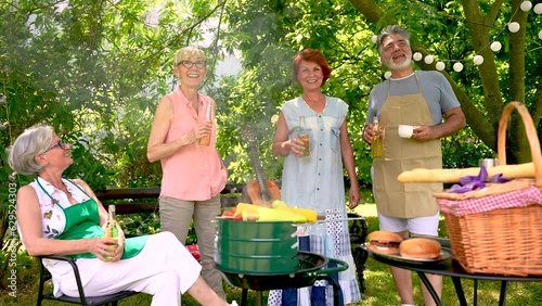 Group of elderly people enjoying their retirement by going on a picnic while making barbeque,memories and making their friendship stronger