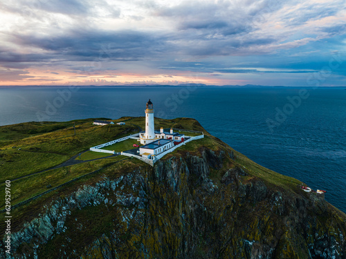 Obraz na plátně Sunset over Mull of Galloway Lighthouse from a drone, Mainland Scotland, UK