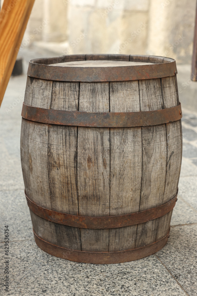 Traditional wooden barrel on street outdoors. Wine making Traditional wooden barrel on street outdoors. Wine making