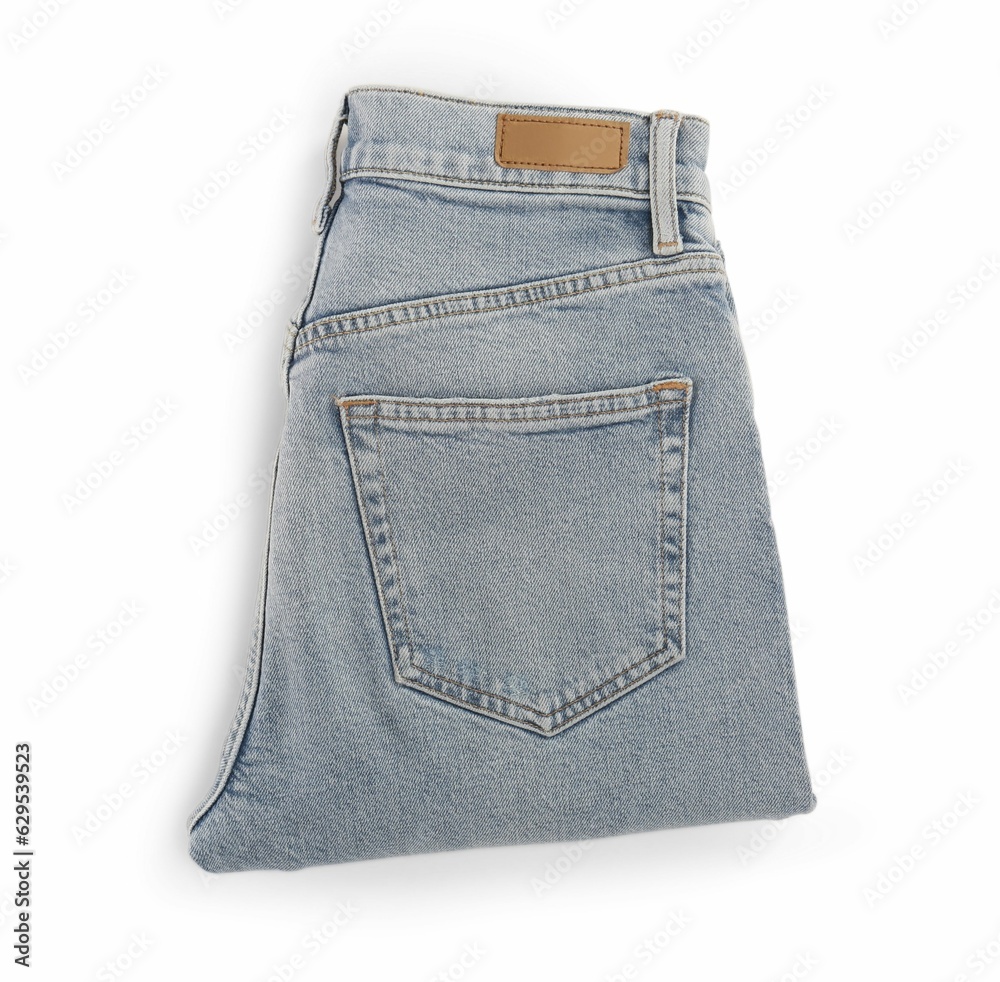 Light blue jeans isolated on white, top view. Stylish clothes Light blue jeans isolated on white, top view. Stylish clothes