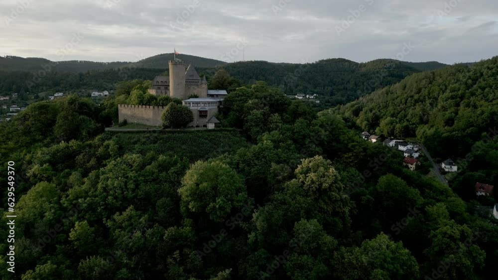 On the mountain is a hilltop castle with a tower On the mountain is a hilltop castle with a tower
