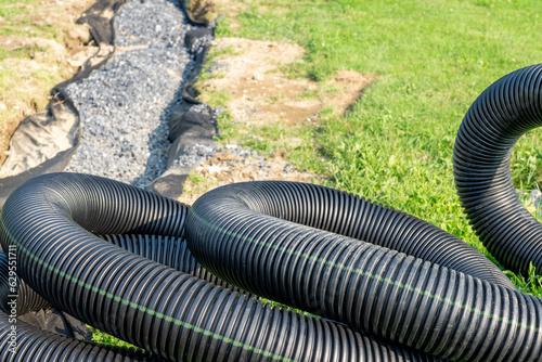 Cuadro en lienzo Black storm water underdrain pipe used to mitigation ground water