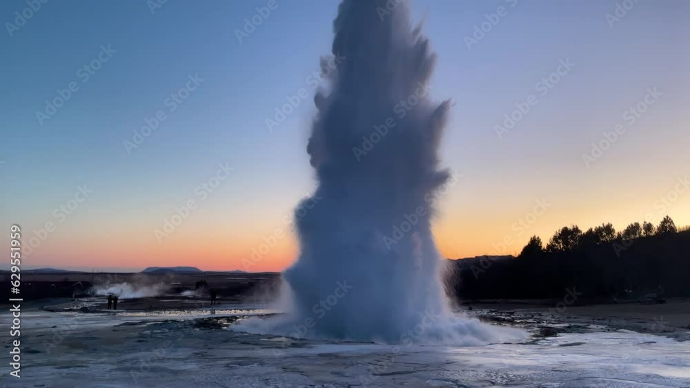 Iceland. Erupting geyser Strokkur. Strokkur is part of geothermal area. Smoke over the ground. The most beautiful places on the Earth.