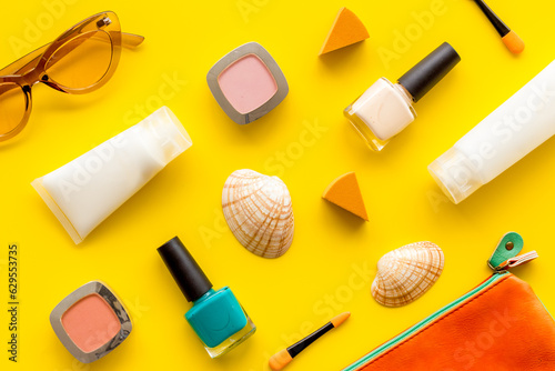 Beach sunscreen makeup cosmetic flatlay. Summer beach concept flatlay