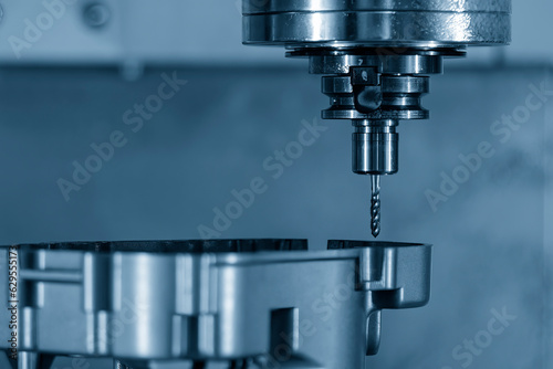 The CNC milling machine thread making the automotive parts by tapping tools.