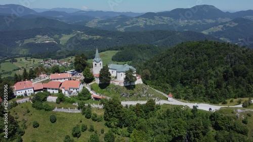 A drone view of an old church located on a hill. The camera moves smoothly to the left. Zasavje Holy Mountain, The Mary’s Nativity Church. photo