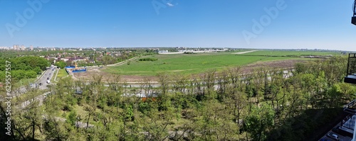 Panorama of a modern green city on a summer day, wide angle