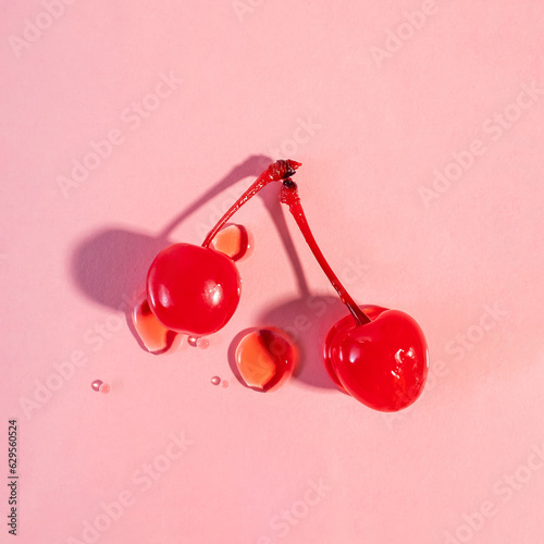 Maraschino sweet cherries isolated on pink background