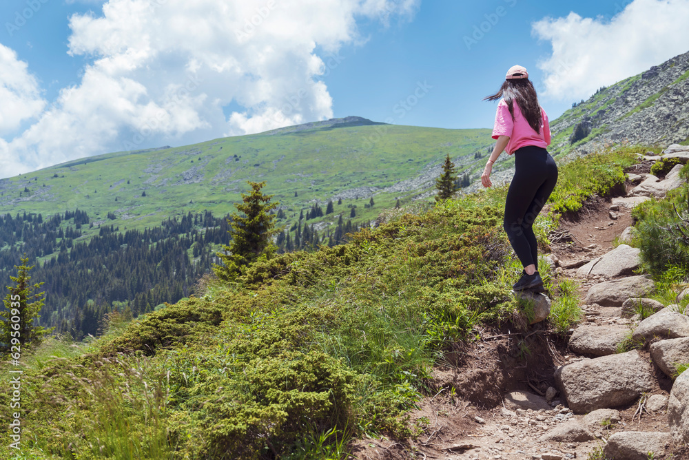 Fit Woman in the beautiful green summer mountain . Vitosha mountain ,Bulgaria