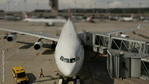 Commercial airplane landing at airport terminal runway after flight