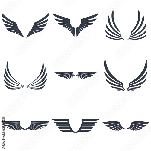 Set of retro inked modern wings icons and emblems for logos  coat of arms signs or other graphic or printing materials.