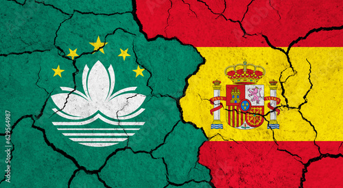 Flags of Macau and Spain on cracked surface - politics, relationship concept