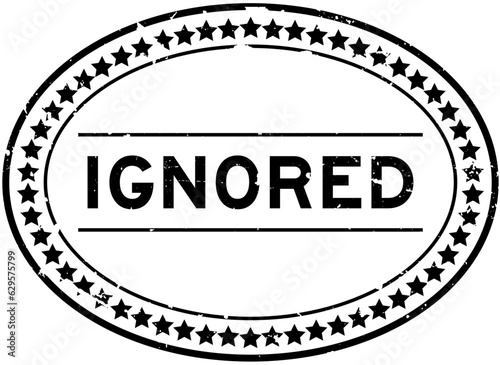 Grunge black ignored word oval rubber seal stamp on white background