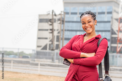 portrait of a beautiful young african business woman outdoor © Confidence