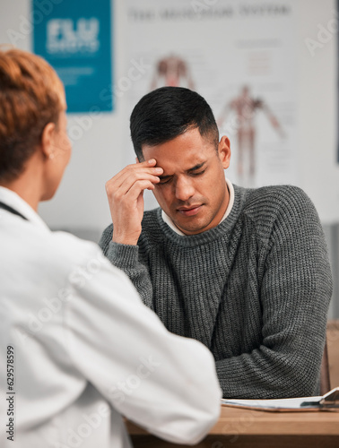 Stress, headache and doctor with patient in consultation, exam or test in hospital clinic with head pain. Burnout, fatigue and medical professional helping a tired or sick man with nursing advice