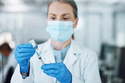 Woman doctor in mask, needle and covid vaccine bottle for hospital laboratory research. Healthcare, medicine and medical professional with sample syringe for corona vaccination in pharmaceutical lab.