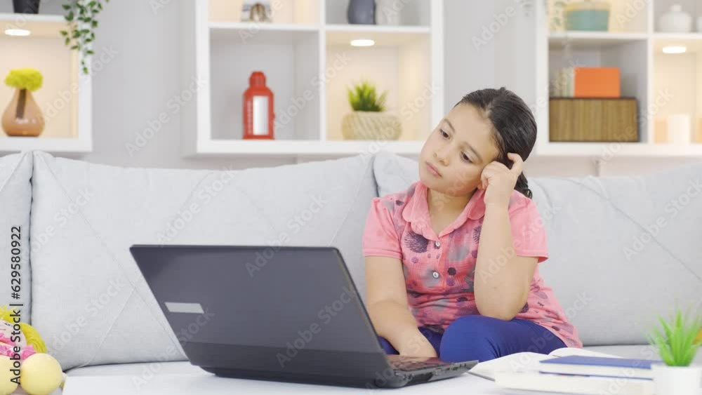 Thoughtful girl child focused on tech stuff. Thoughtful girl child focused on tech stuff.