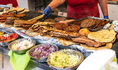 Serbian traditional cuisine street food, grilled meat, patty, burgers, sausages, cooking