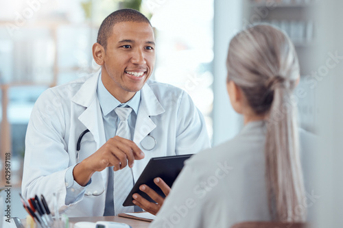 Tablet, office and doctor consulting a patient in a health conversation or communication during medical consultation. Medicine, healthcare and professional talking to person for results in a clinic