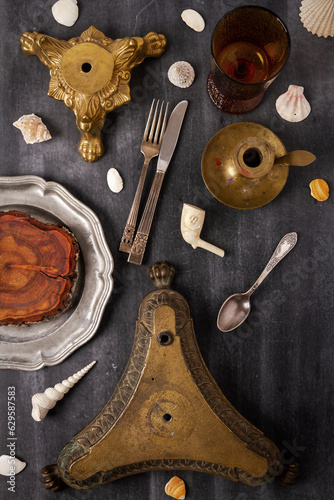 Various antique objects on black chalkboard background