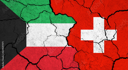 Flags of Kuwait and Switzerland on cracked surface - politics, relationship concept