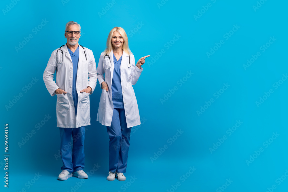 Horizontal full length shot of cheerful senior doctors, copy space Horizontal full length shot of cheerful senior doctors, copy space