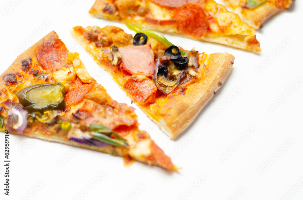 Different slices of pizza with pepperoni, ham, mushrooms, mozzarella and olives