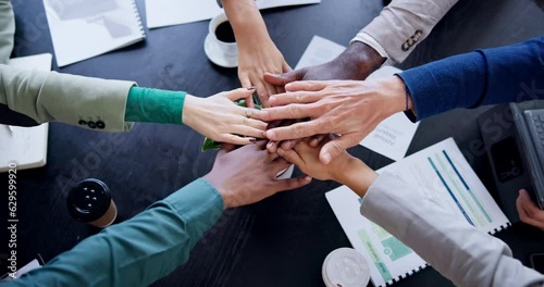 Business meeting, people and hands together for teamwork, support or collaboration on project goals, success and celebration. Circle planning, motivation and group or team with stack sign above table photo