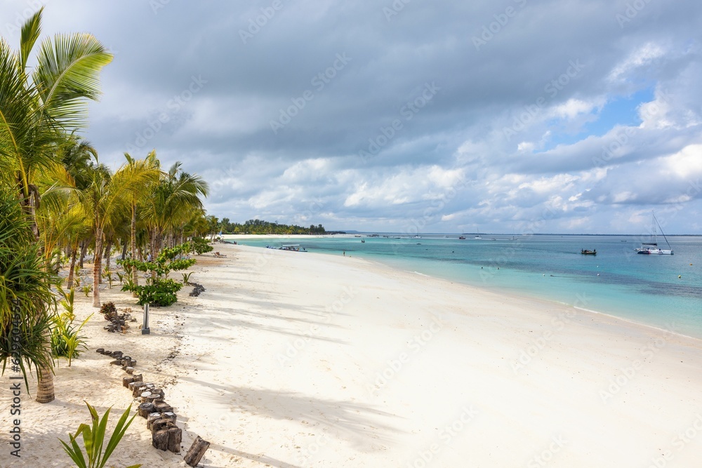 Beautiful tropical beach with white sand and clear blue water on the island of Zanzibar