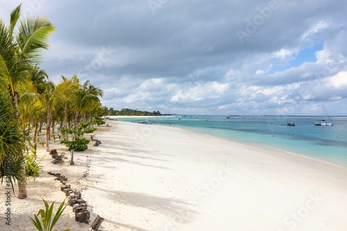 Fototapeta Naklejka Na Ścianę i Meble -  Beautiful tropical beach with white sand and clear blue water on the island of Zanzibar