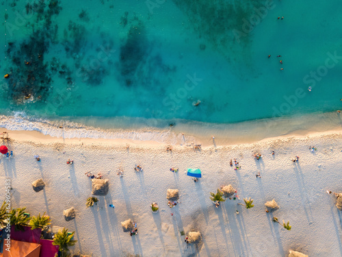 Aerial view of Arashi Beach at sunset in Aruba.