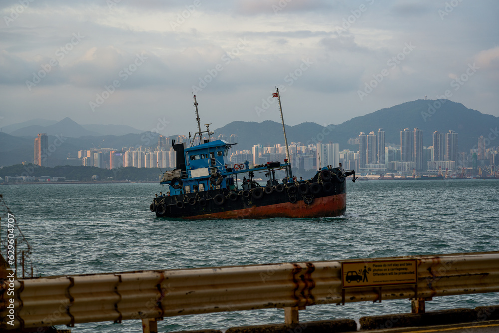 Large fishing boats docked by the sea in Hong Kong