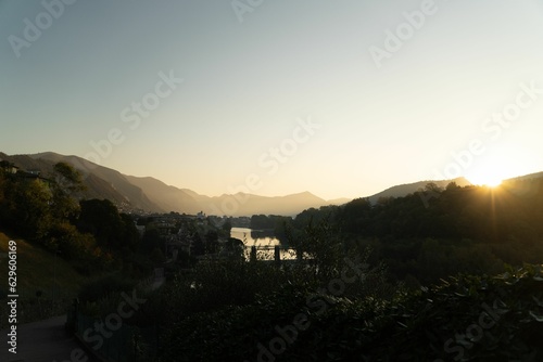 Stunning view of the town of Iseo tucked away behind lush green trees and hills